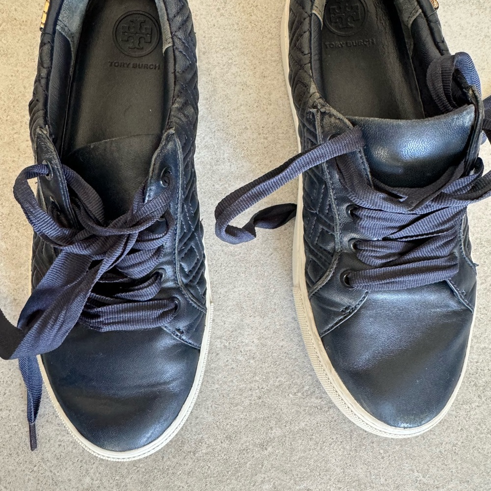 Authentic Tory Burch shoes. Dark navy blue. Pre loved and worn condition.